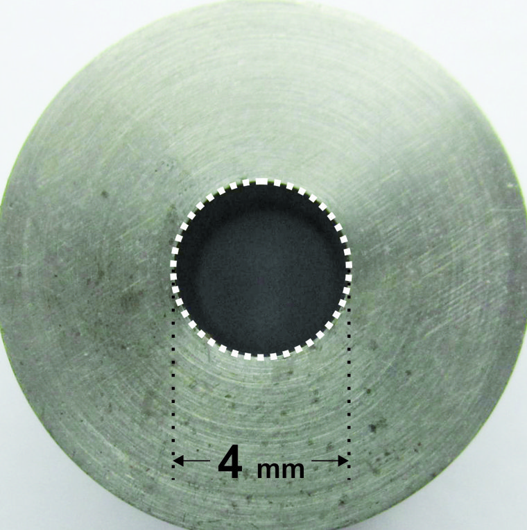 The stainless steel depth-of-cure mold with its 4 mm bore