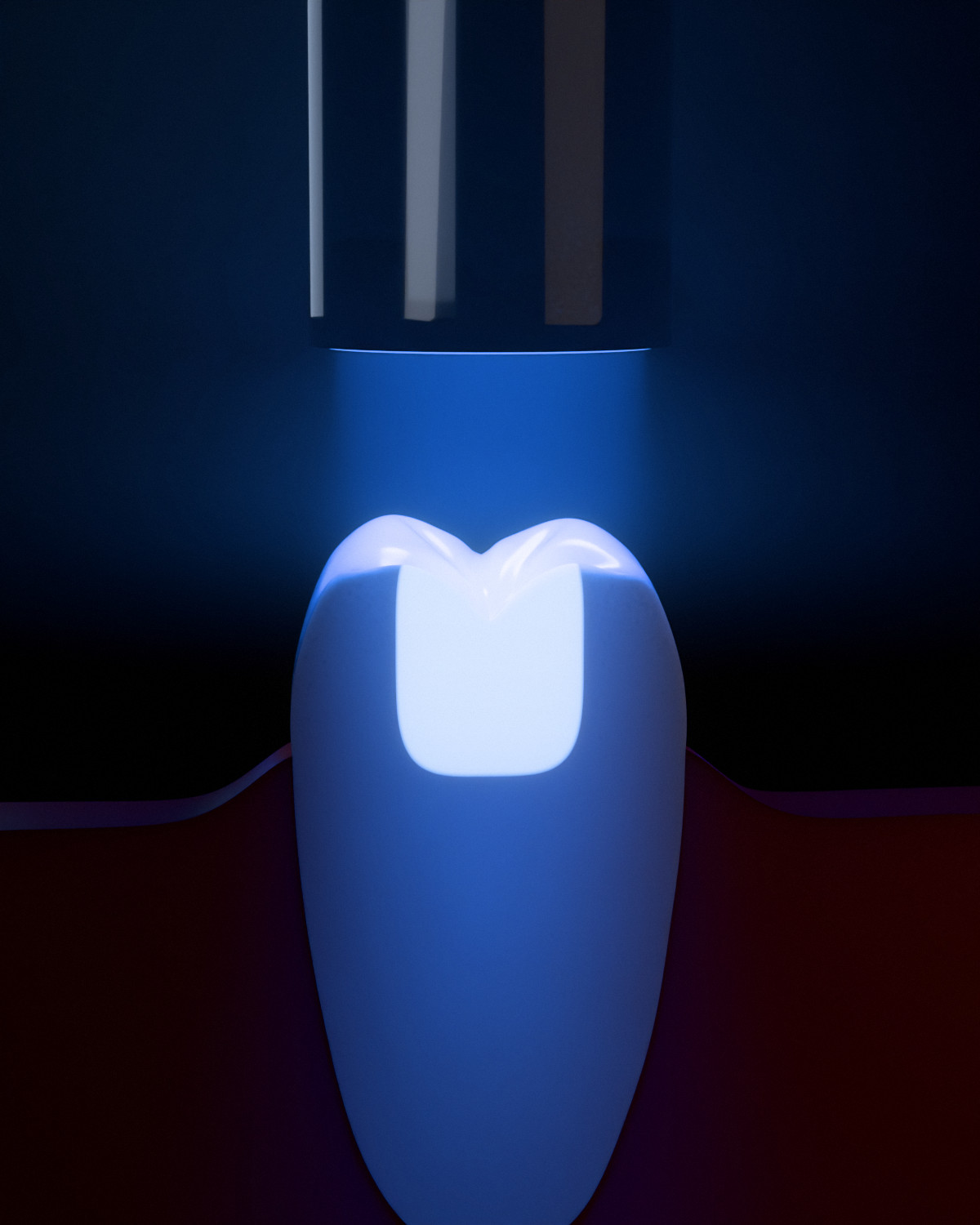 A tooth cut through the middle of its filling. The whole filling glows, down to its floor.